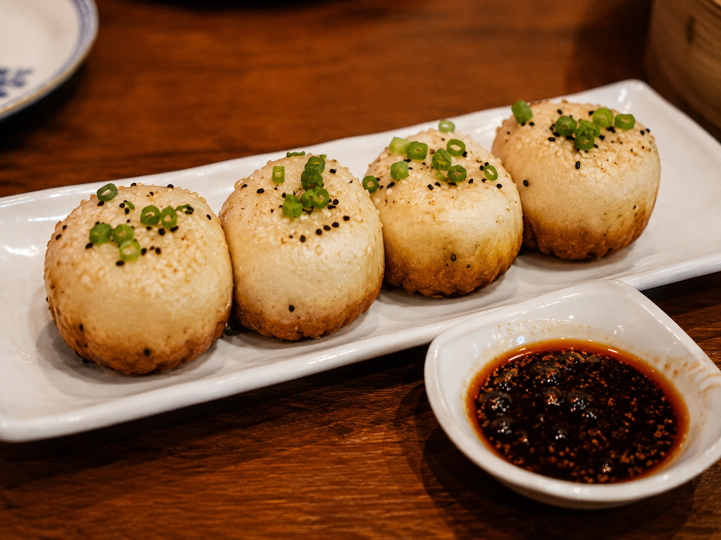 Sheng jian bao pan-fried pork buns with crisp golden bottoms